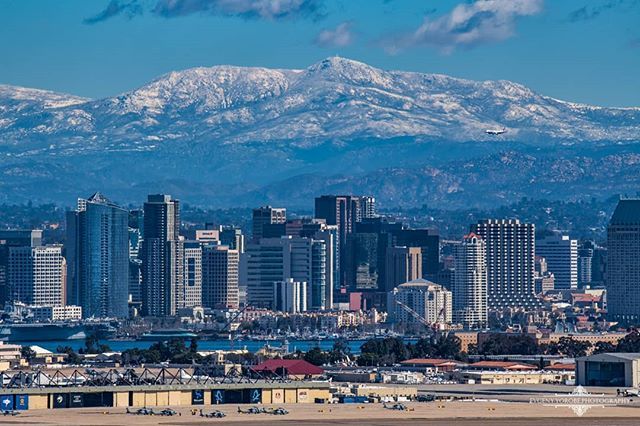Downtown San Diego with mountain peaks in the background, reflecting both city access and the region's mountain landscape.